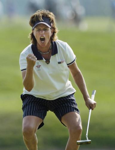 United States Solheim Cup member Rosie Jones pumps her fist as she watches her putt on the 11th green during the first round of four-ball match