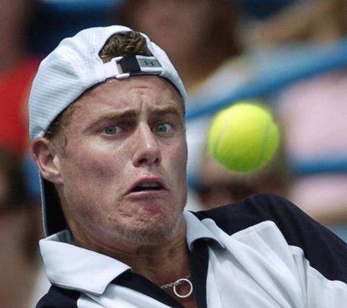 Australia's Lleyton Hewitt eyes a volley from Croatia's Mario Ancic during their third round match