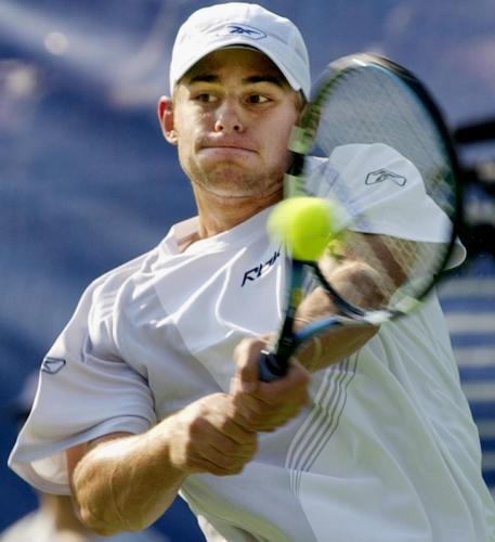 ANDY RODDICK  RETURNS A SERVE TO XAVIER MALISSE