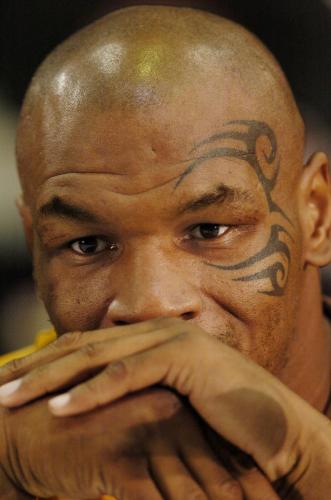 Mike Tyson listens to questions from the media during the final press conference in Louisville