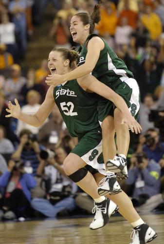 Michigan State University' Liz Shimek and Lindsay Bowen celebrate their 68-64 win over the University of Tennessee