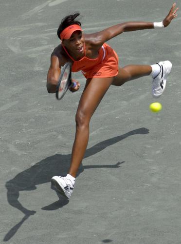 Venus Williams returns a shot to Jelena Jankovic during their semi-final match in the 2007 Family Circle Cup in Charleston